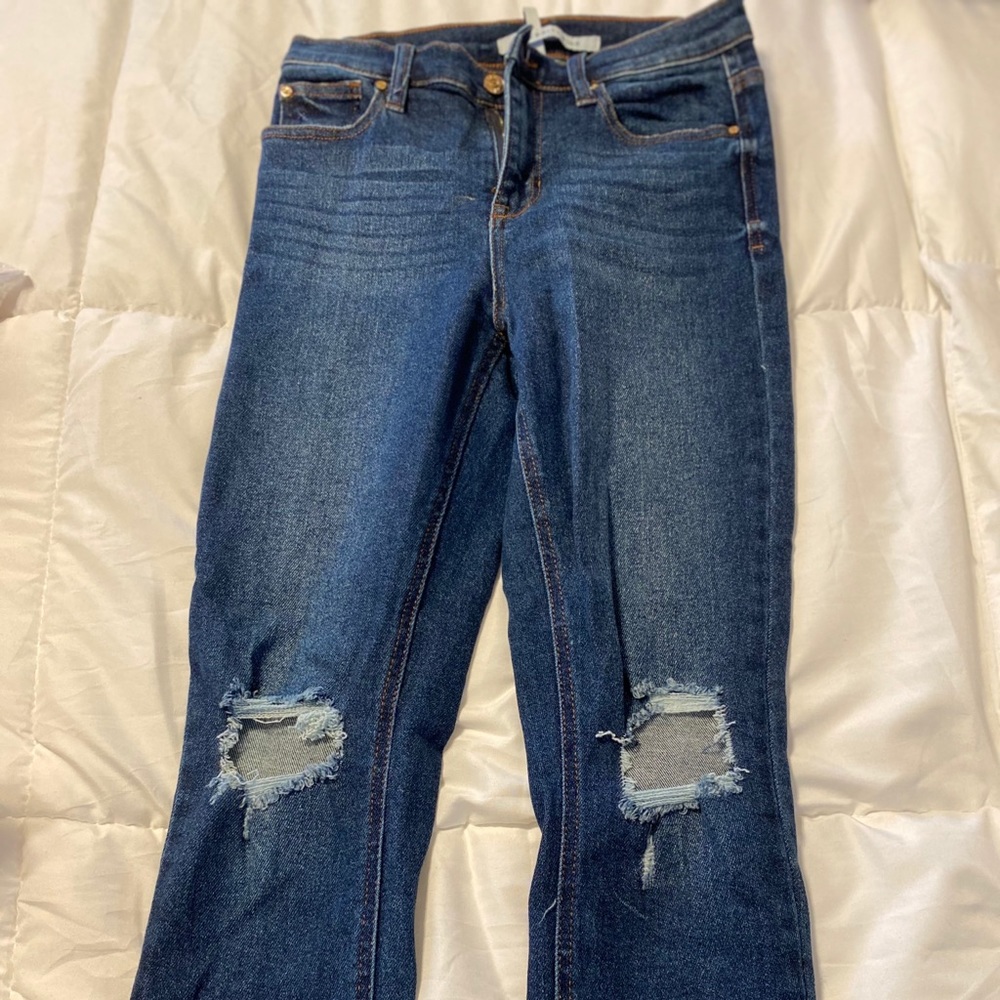 High rise blue jeans.